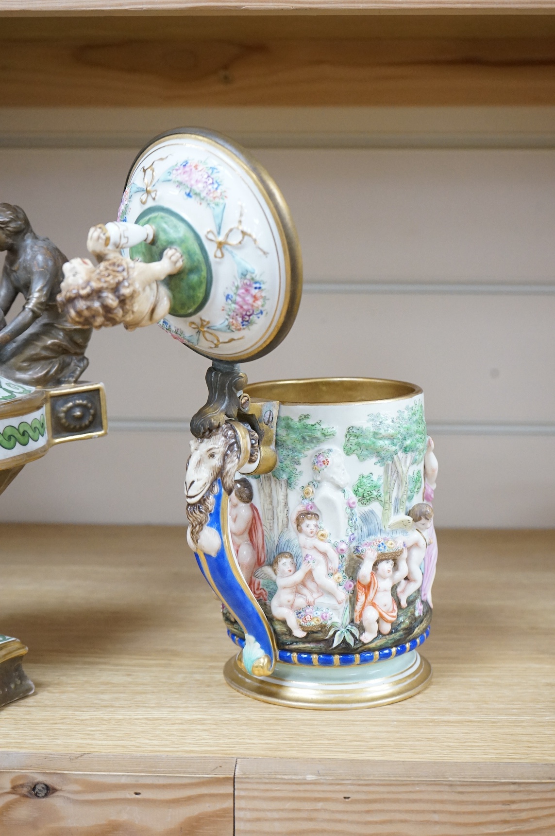 A Richard Ginori, Doccia porcelain tankard and a hand painted porcelain oil lamp, largest 27cm wide. Condition - fair/good